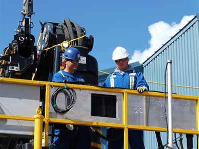 Two Chamco workers in Personal Protective Equipment