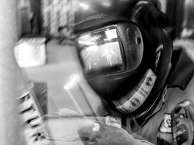 Black and white photo of a welder