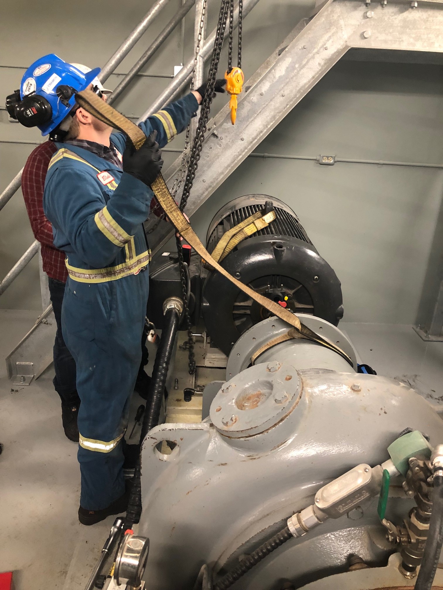 Technician doing pump alignment in shop