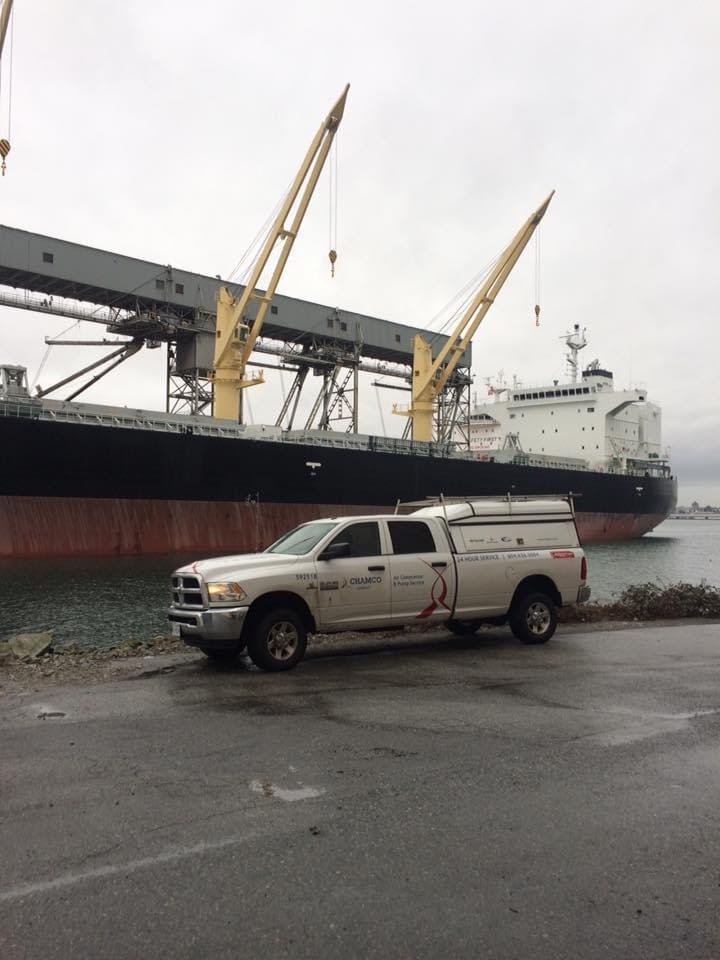 A chamco truck in Vancouver next to a ship