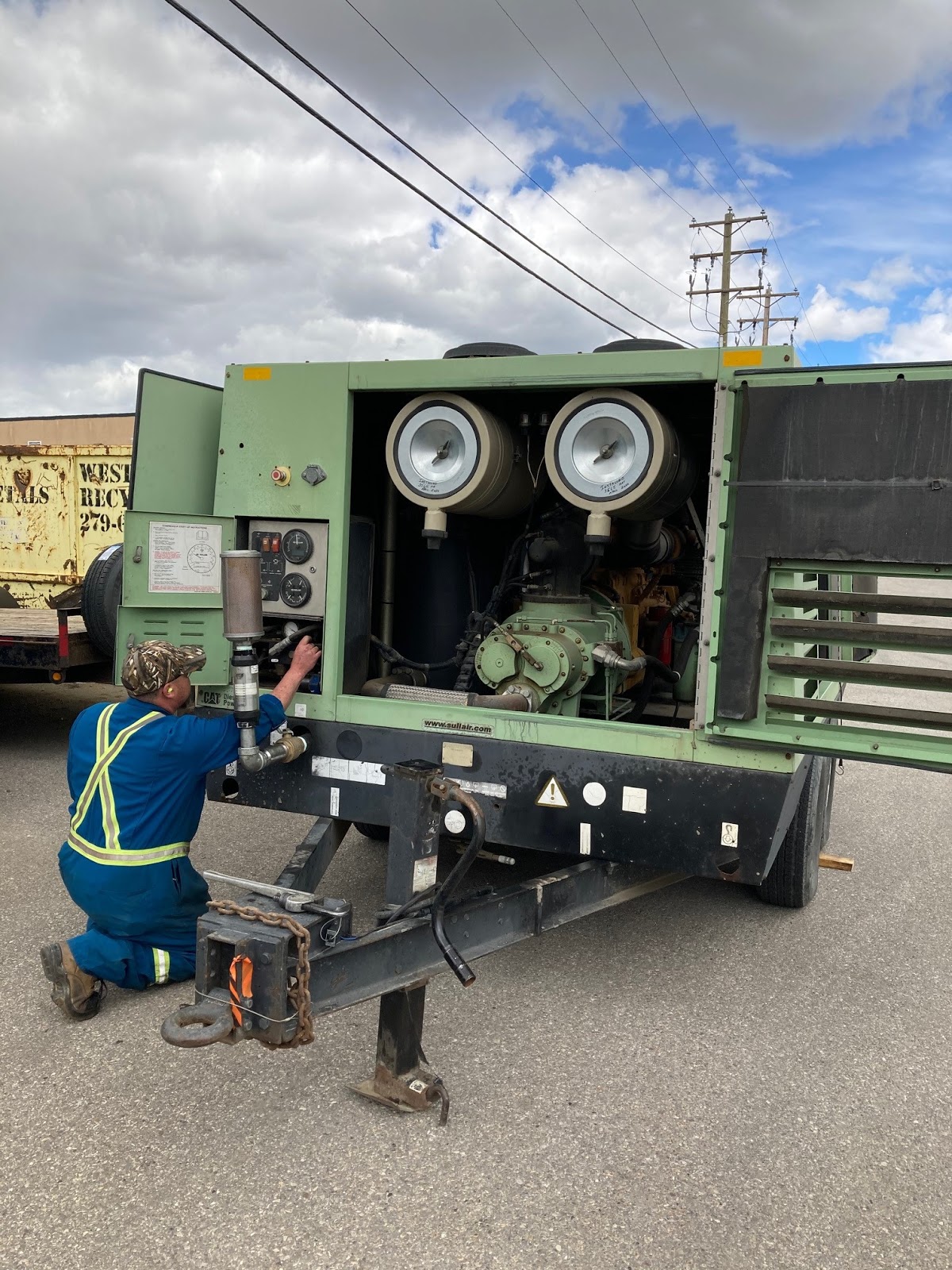 A portable compressor being serviced