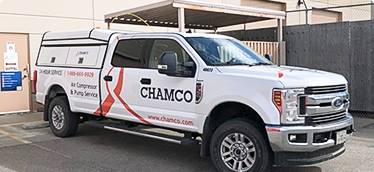 Chamco technician works on air compressors