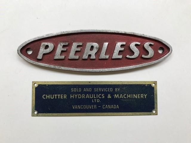 A plaque that says "Chutter Hydraulics & Machinery" under a Peerless plaque