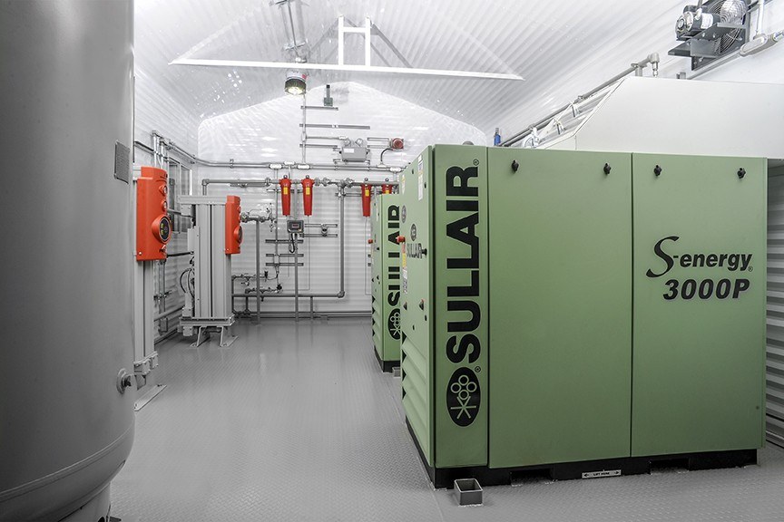 sullair-air-compressors Two green Sullair air compressors
