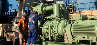 Chamco technician works on air compressors