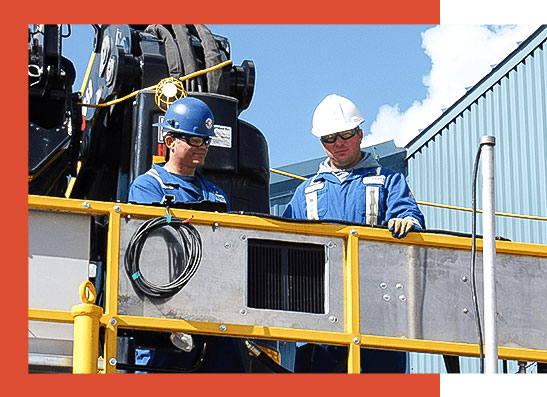 Two engineers working on a water pump station.