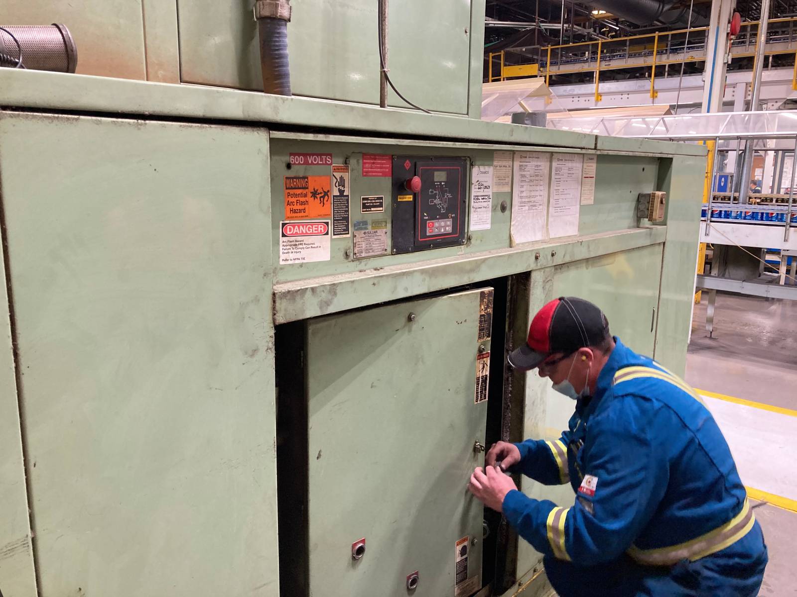 A Chamco technician fixing an air compressor.