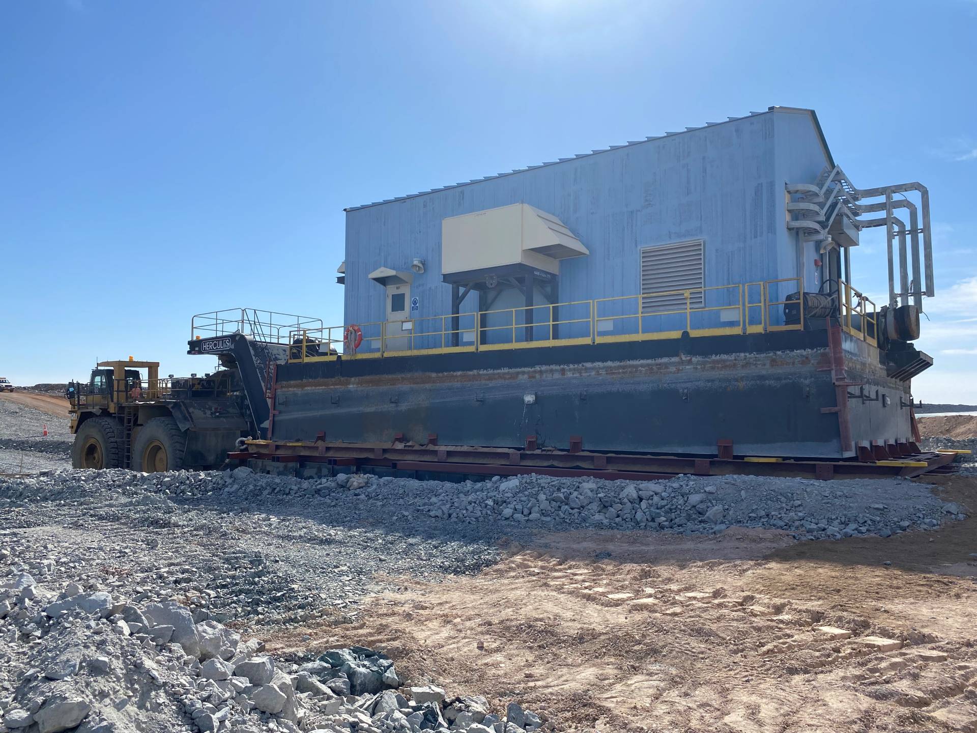 A barge in motion during a relocation project for a remote Mongolian mine.